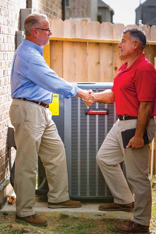 WeaveAire technician reviewing Amana system options with a homeowner